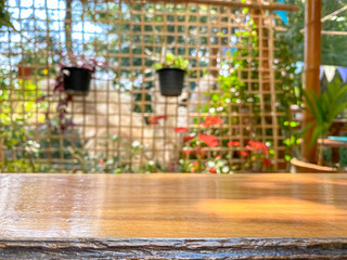 Empty wooden table and blurred   garden background