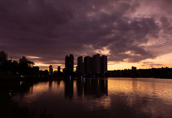 Wonderful Sunset and View of the lake in the Park of the Nations Indigenous and buildings in the...