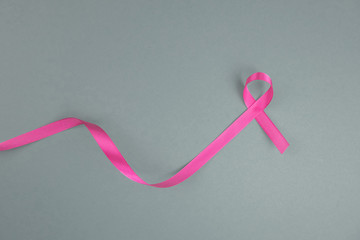 Pink ribbon, symbol of breast cancer, cancer awareness month.