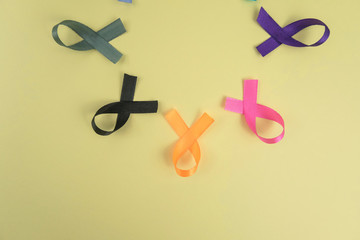 Different ribbons, symbols of cancer, cancer awareness month.  Copy space for your text.