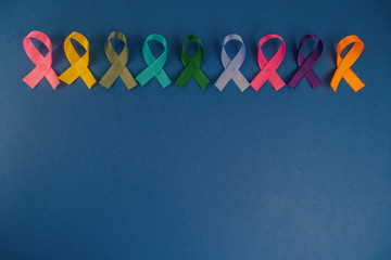 Different ribbons, symbols of cancer, cancer awareness month.  Copy space for your text.