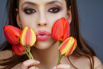 Beauty women feeling good relax with tulip flovers.