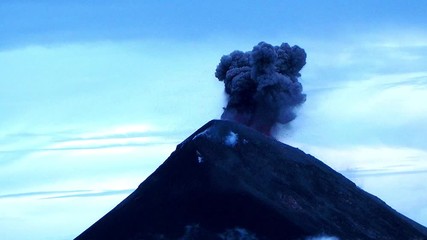 Guatemala, Fuego volcano erupting in day time.