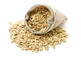 Pumpkin seeds on white background 