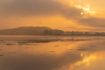 Morning nature scene, sky, clouds and fog (mist) on the lake