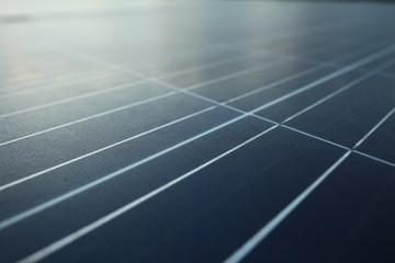 Solar panels on the roof of a tropical city house early in the morning at dawn.