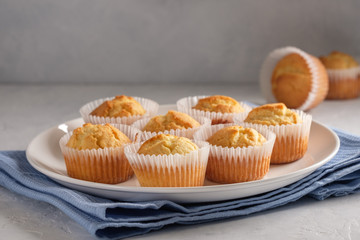 Delicate and delicious lemon cupcakes with crisp on a white plate