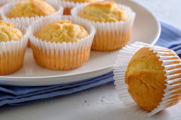 Delicate and delicious lemon cupcakes with crisp on a white plate