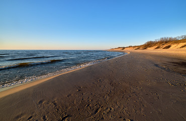Fototapeta premium Sunset at Baltic sea and nordic dunes of Curonian spit, Nida, Lithuania