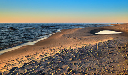 Sunset at Baltic sea and nordic dunes of Curonian spit, Nida, Lithuania