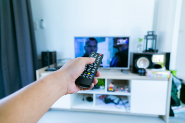 body part hand holding remote television