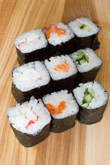 Fresh and delicious rolls, sushi and Japanese cuisine. rolls with salmon, avocado, cucumber, flying fish ROE and cream cheese inside. Sushi menu. Flatley food. the view from the top.