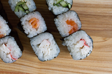 Fresh and delicious rolls, sushi and Japanese cuisine. rolls with salmon, avocado, cucumber, flying fish ROE and cream cheese inside. Sushi menu. Flatley food. the view from the top.