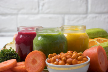 Assortment of jars with tasty baby food on wooden table. vegetable and fruit purees.