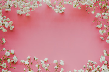 Obraz na płótnie Canvas Gypsophila white baby's breath flower on pastel pink background with copy space. Sweet and beautiful wallpaper for Valentine or wedding backdrop design. Gypsophila flower is mean forever love.