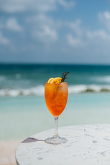 Cocktail Orange Color and Beachside View and Sky