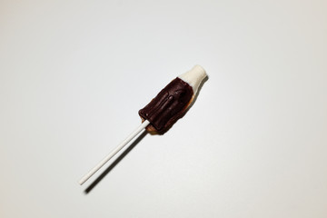 Coke bottle-shaped cola flavored lollipops