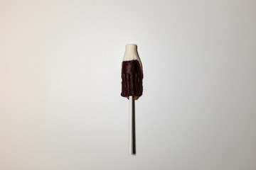 Coke bottle-shaped cola flavored lollipops