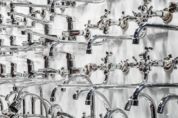 different types of water faucets and taps on the shop window