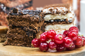 sponge cakes with chocolate in the window of a pastry shop. Focus on the cake