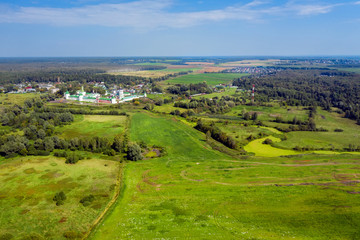 Fototapeta na wymiar Aerial view over the surroundings Nikolo-Peshnoshsky Monastery on a summer day