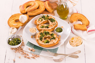 Friselle with turnip tops and hummus.