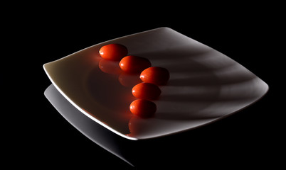 Tomatoes on a white dish