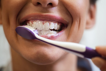 Fototapeta premium Taking care of her teeth!