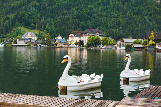 view of catamaran in swan shape lake in alpine mountains © phpetrunina14