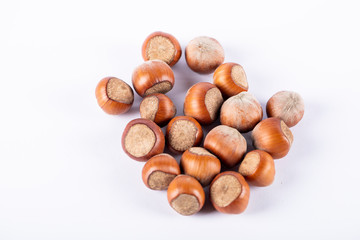 A bunch of nuts in the center of a white background