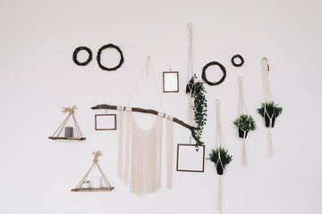 Home interior design with mock up posters on the wall, handmade macrame.  scandi-boho style. 