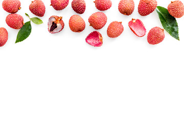 Lychee frame. Fresh juicy fruits on white background top-down copy space
