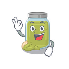 A funny picture of pumpkin seed butter making an Okay gesture