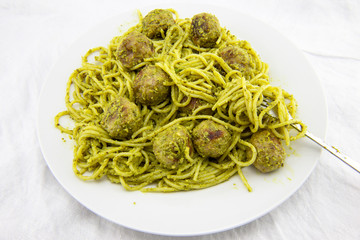 meatballs with pasta and pesto sauce