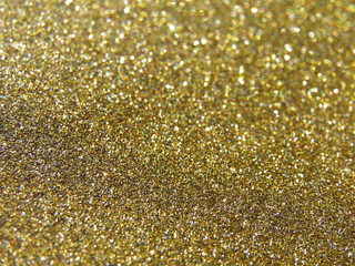 shiny gold glitter texture background, wrapping paper.