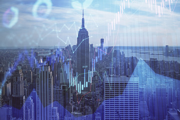 Forex graph on city view with skyscrapers background double exposure. Financial analysis concept.