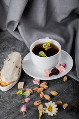 Earl grey tea with lokum , milky dessert and pistachios