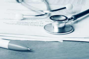 Stethoscope, medical documents, insurance concept.