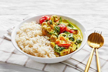 Sticky rice with yellow coconut curry on a plate