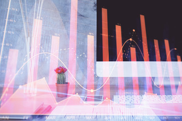 Forex graph hologram on table with computer background. Multi exposure. Concept of financial markets.