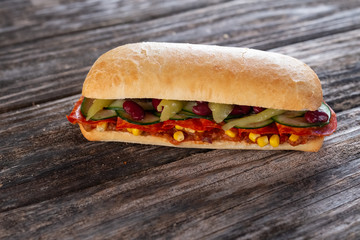 sandwich with salami and vegetables