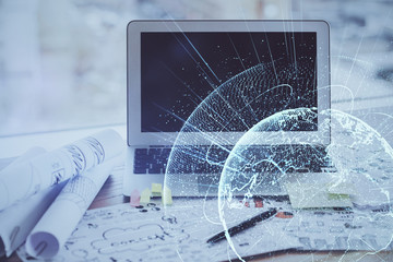 Computer on desktop with social network hologram. Multi exposure. Concept of international people connections.