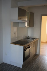 Fitted kitchen in a residential rental apartment 