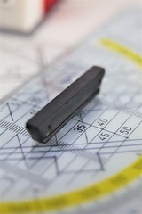 pen and calculator on blueprint