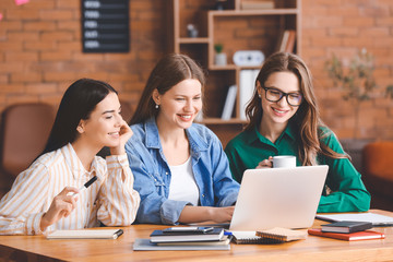 Beautiful young businesswomen working together in office