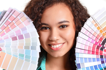African-American woman with color palettes on white background