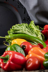 Hot chili peppers tray with lettuce on a piece of burlap