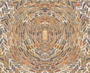 Cobblestone pattern with circular ornament closeup