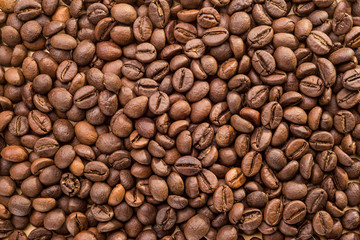 Close-up of brown roasted coffee beans texture