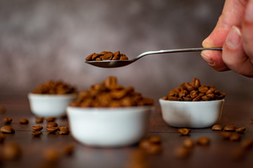Tea spoon coffee bean close-up with bokeh effect
